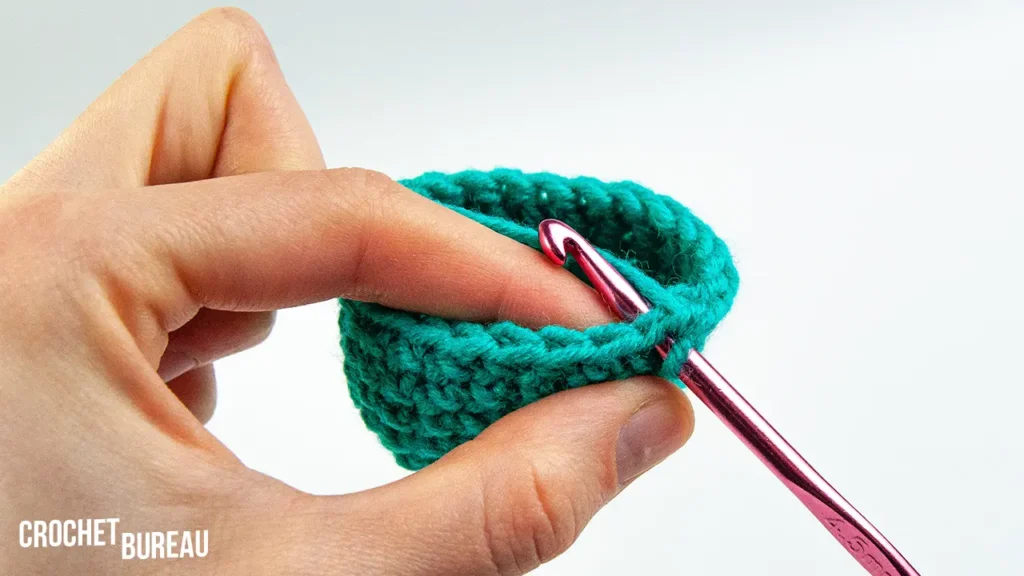 inserting your crochet hook from the front of the post towards the back
